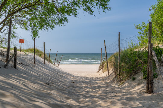 Baltic sea coast, entrance to the beach through the sand dunes, Rowy, Ustka, Poland