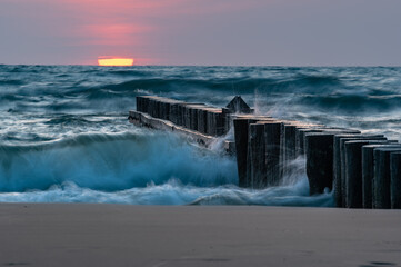 Wooden breakwater - Baltic seascape at sunset, Poland