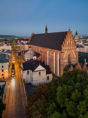 Obraz premium Picturesque old town Dominikanska street and Holuy Trinity church during blue hour, Krakow, Poland