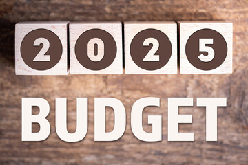 Budget 2025 new year on wooden blocks and office business concept background. 2025 Budget planning and allocation concept concept. 2025 New year resolutions, goals