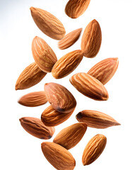 Obraz premium Shelled almonds falling freely vertically on white background
