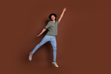 Full body photo of attractive young man hanging have fun dressed stylish khaki clothes isolated on brown color background