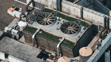 A large industrial building with two large cooling towers on top