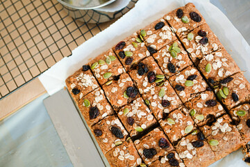 banana bread. this banana bread is homemade, i used brown sugar, flour, egg and also rile bananas. the top of the bread is almond slices, raisin, nuts and oat. the taste is so good and sweet.