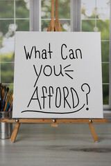 What can you afford? Handwritten on white square canvas vertical photo.