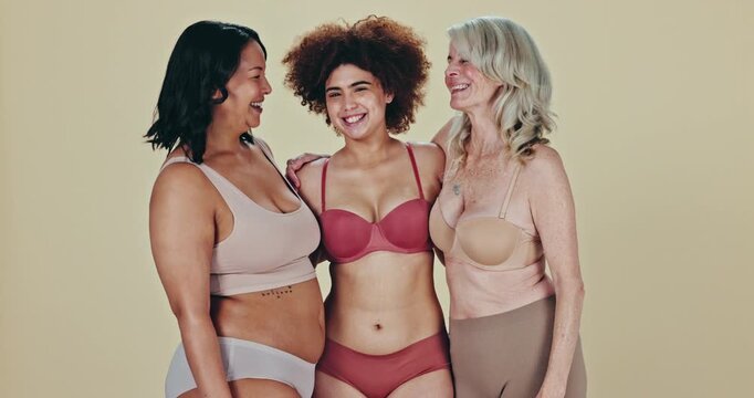 Face, diversity and women with wellness, hug and cheerful people with joy on a studio background. Portrait, group and friends with happiness, positive and body with health, wellness and bonding