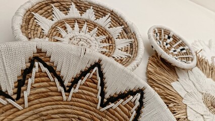 A collection of woven baskets with a floral design