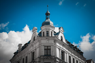 Fototapeta premium Beautiful gothic building of a medieval City Hall in Torun, Poland. Historical street of an ancient European city.