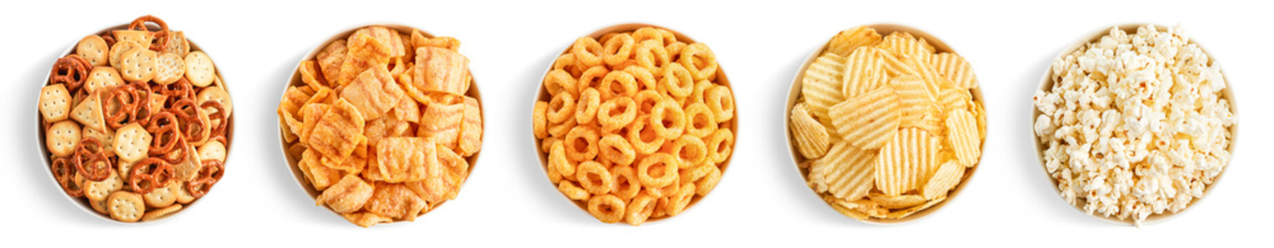 Set of various salty snacks in bowls on white background. Potato chips, popcorn, bacon chips, onion rings, creckers and pretzels