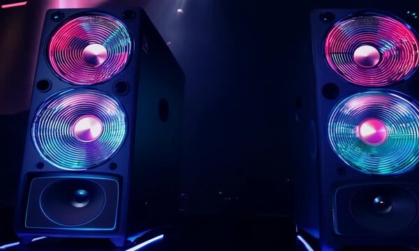 Vibrant speaker system with colorful lights in dark Room creating a party atmosphere