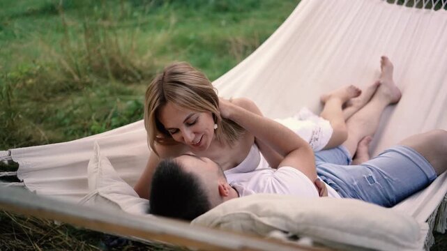 loving couple in hammock, millennials
