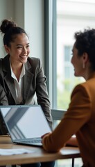 Obraz premium Professional Women Engaging in a Collaborative Discussion at Office