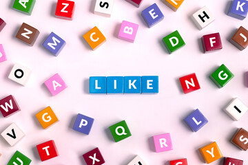 LIKE Word made of blue Cubes, top view on colorful cubes with letters 