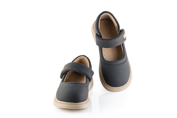 Cute child's black shoes, isolated on a white background. Full depth of field.