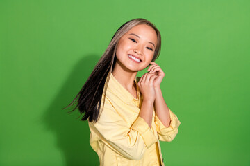 Fototapeta premium Portrait of pretty young woman toothy smile wear jacket isolated on green color background