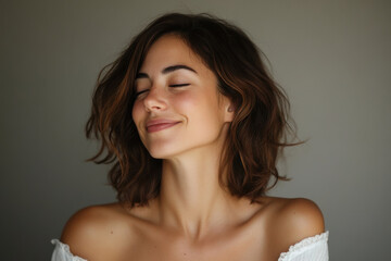 A close up of a woman's face with her eyes closed