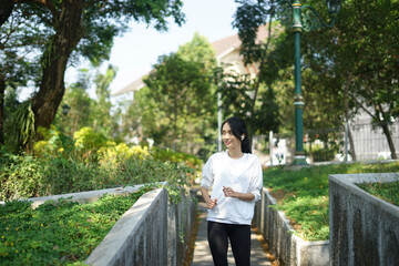 Fototapeta premium young woman running in the park