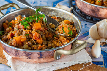 Brown lentils stew with white wine, serrano ham and smoked paprika