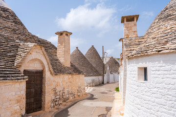 Famous historical old dry stone trulli houses with conical roofs in Alberobello, Italy.