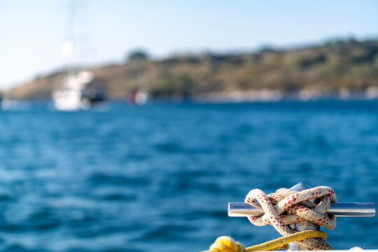 sailors knot in front of the yacht boat. luxury and private concept. boat on the sea, summer cruise vacation. Sailing yacht fishing holidays. islands lifestyle. anchor rope tied. Tourism see view.