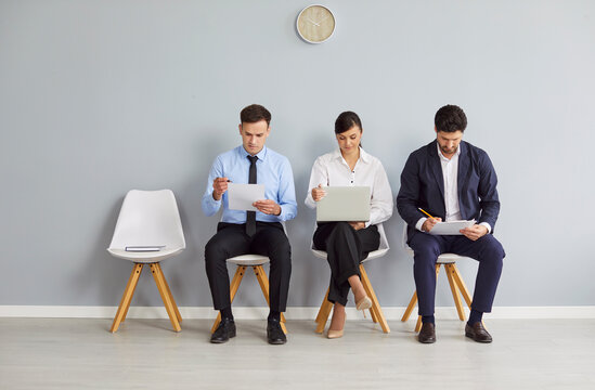 Diverse job candidates sitting on office chairs in row, business people waiting for job interview, human resources, employment and recruitment, candidates looking for hiring, hr making choice