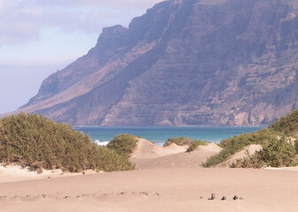 Beach and mountains - beautiful coast in Caleta de Famara, Lanzarote Canary Islands.