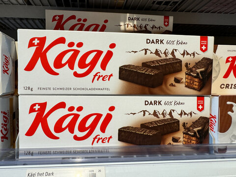 Grindelwald, Switzerland - July 21, 2024: Boxes of Kagi dark chocolate wafers cookies for sale in a Coop grocery store