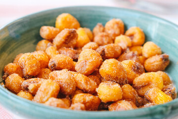 A Close-up View Of a Bowl Filled With Crispy, Seasoned Corn Nuts