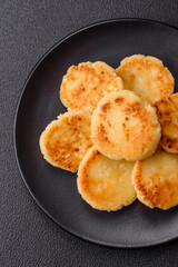 Delicious fresh sweet cheese pancakes with raisins and cinnamon