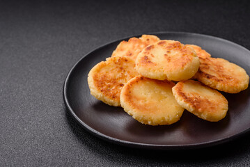 Delicious fresh sweet cheese pancakes with raisins and cinnamon