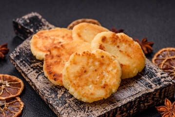 Delicious fresh sweet cheese pancakes with raisins and cinnamon