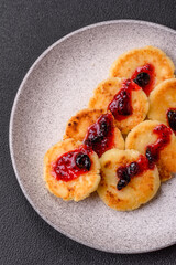 Delicious fresh sweet cheese pancakes with raisins and cinnamon