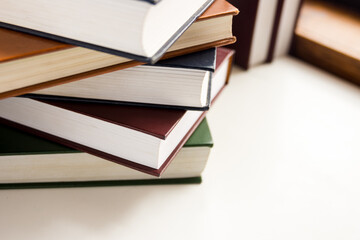 a stack of hymnals on a desk