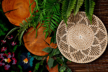 decorations with wheat and other plants in a vase and an embroidered ornament