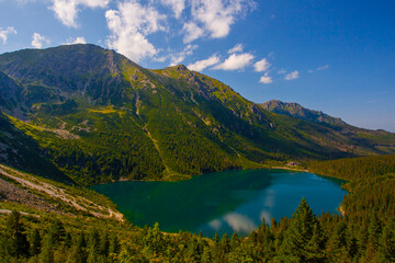 Fototapeta premium View from above of Morskie Oko, or Eye of the Sea. Beautiful mountain lake. Summer landscape in the Tatras, Poland.