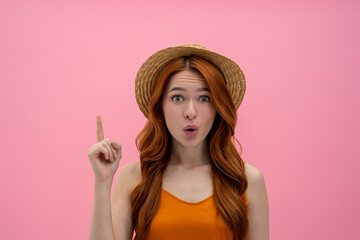 Pretty long-haired woman looking surprised and impressed