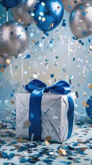 silver gift party box with blue ribbon bow on background with balloons, confetti.Space for text,party concept or birthday celebration