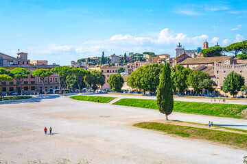Fototapeta premium The Circus Maximus, Italian: Circo Massimo, an ancient Roman chariot-racing stadium and mass entertainment place in ancient Rome, Italy. With buildings of Palatine Hill on background
