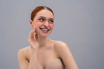 Gorgeous female with under eye patches smiling while looking away