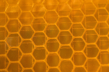 Close-up of orange hexagonal reflective texture
A close-up view of an orange hexagonal reflective...