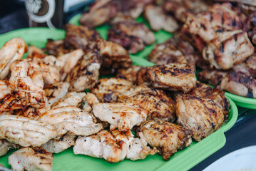 barbecue on skewers on tray in counter in street, grilled meat, street food concept