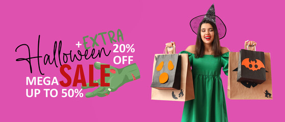 Young woman dressed for Halloween as witch with gift bags on purple background
