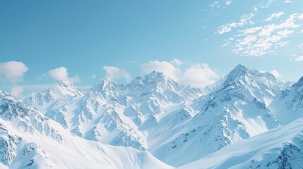 Fototapeta premium Snow-covered mountain peaks under a clear blue sky