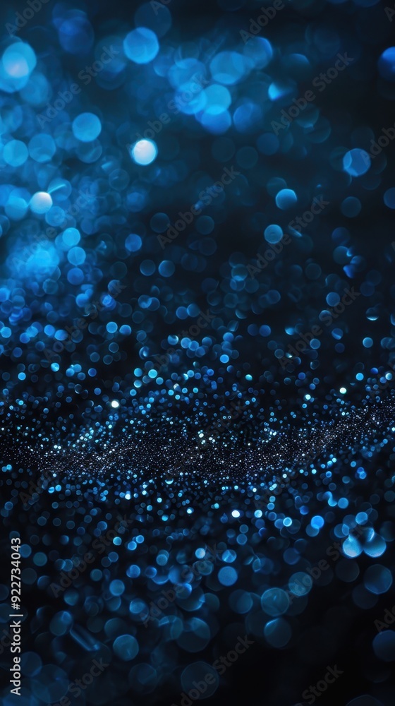 Poster a mesmerizing bokeh effect with blue and dark tones creating an abstract night sky appearance.