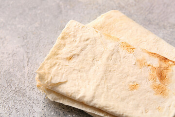 Fresh lavash on grey background