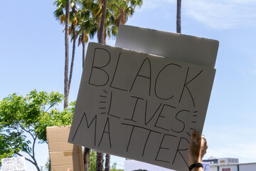 black lives matter - BLM Protest Sign - person holding protest sign