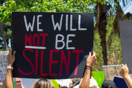 We will not be silent - BLM Protest Sign - person holding protest sign