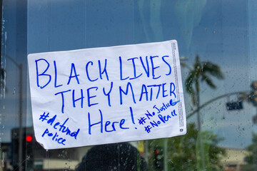 Fototapeta premium Black Lives they matter here - Protest Sign on metro bus window sign
