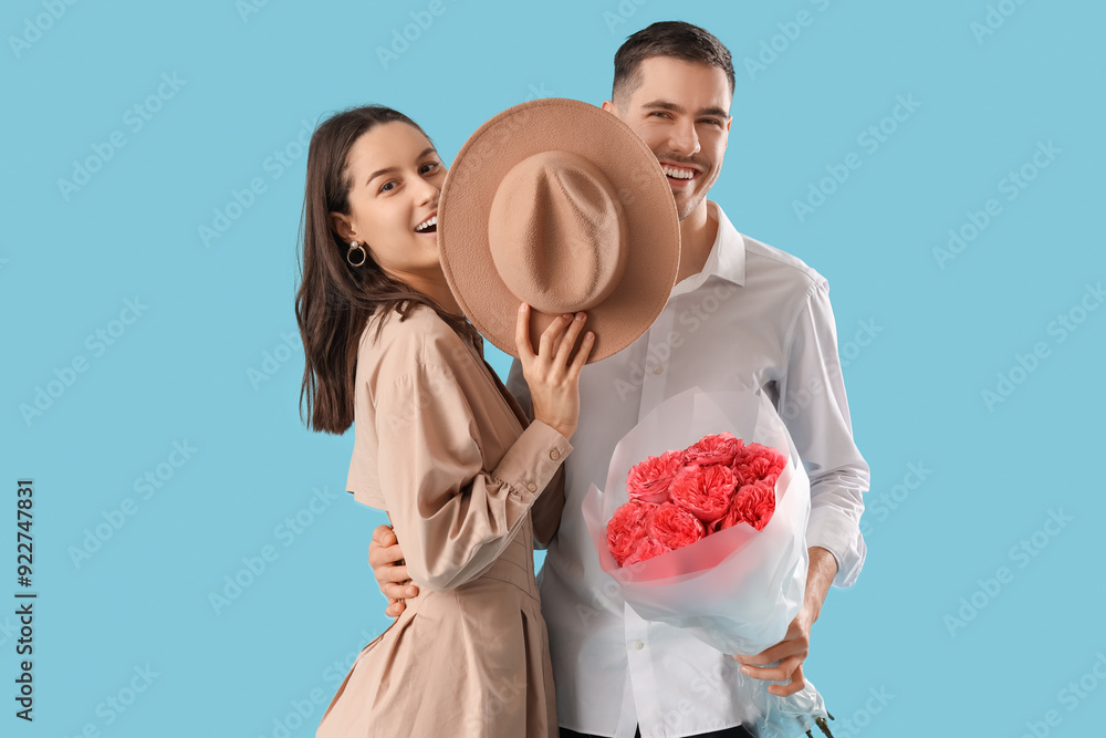 Sticker happy young couple with bouquet of roses on blue background