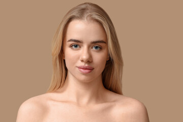 Young woman with beautiful lips on brown background